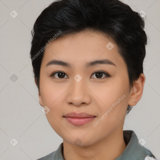 Joyful asian young-adult female with short  black hair and brown eyes