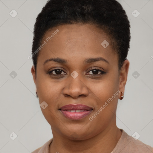Joyful black young-adult female with short  brown hair and brown eyes
