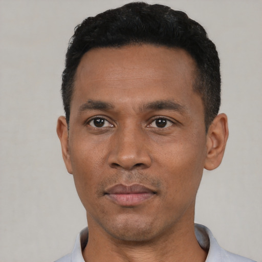 Neutral black young-adult male with short  black hair and brown eyes