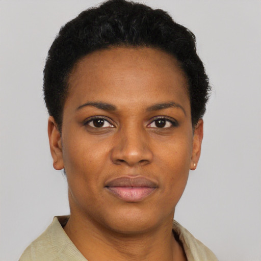 Joyful black young-adult female with short  black hair and brown eyes