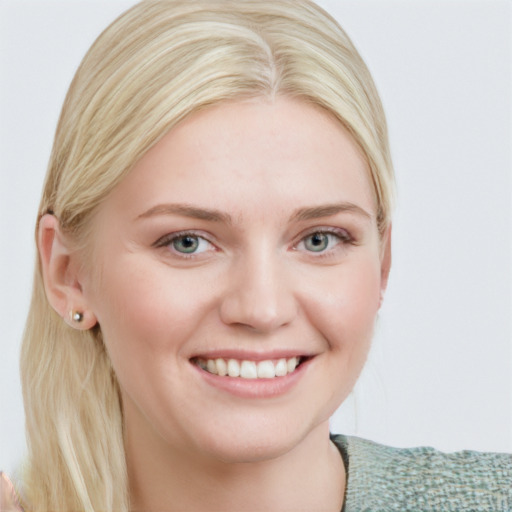 Joyful white young-adult female with medium  brown hair and blue eyes