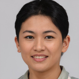 Joyful asian young-adult female with short  black hair and brown eyes