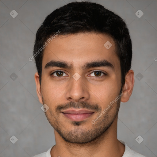 Joyful latino young-adult male with short  black hair and brown eyes