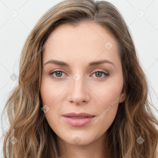 Joyful white young-adult female with long  brown hair and blue eyes