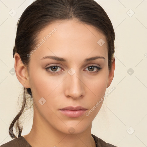 Neutral white young-adult female with long  brown hair and brown eyes