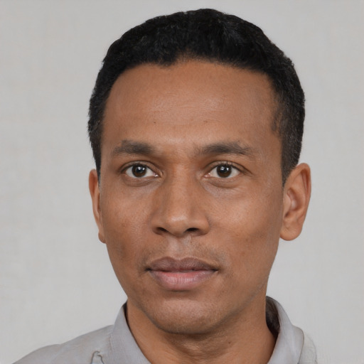 Neutral black young-adult male with short  black hair and brown eyes