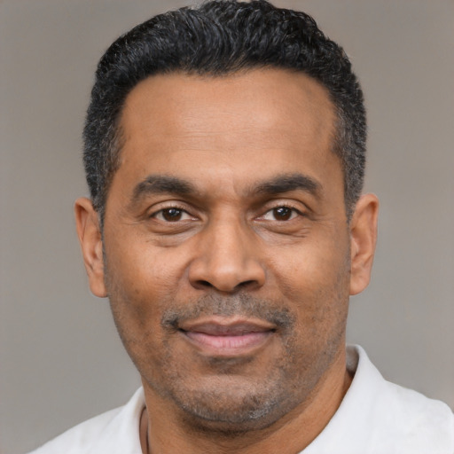 Neutral latino adult male with short  black hair and brown eyes