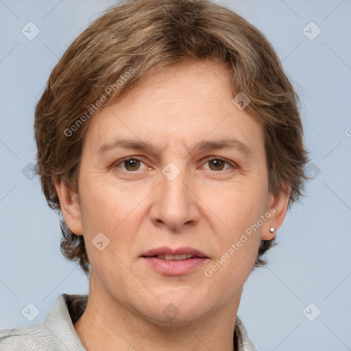 Joyful white adult female with short  brown hair and grey eyes