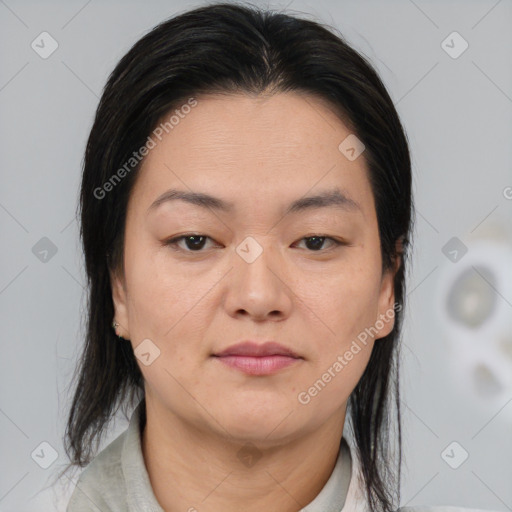 Joyful asian young-adult female with medium  brown hair and brown eyes