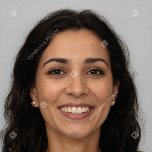 Joyful latino young-adult female with long  brown hair and brown eyes