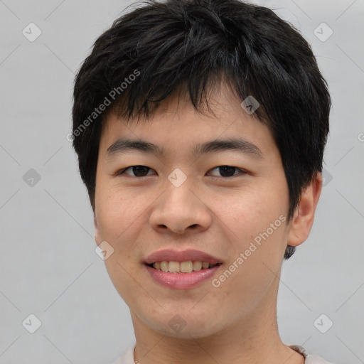 Joyful asian young-adult male with short  brown hair and brown eyes