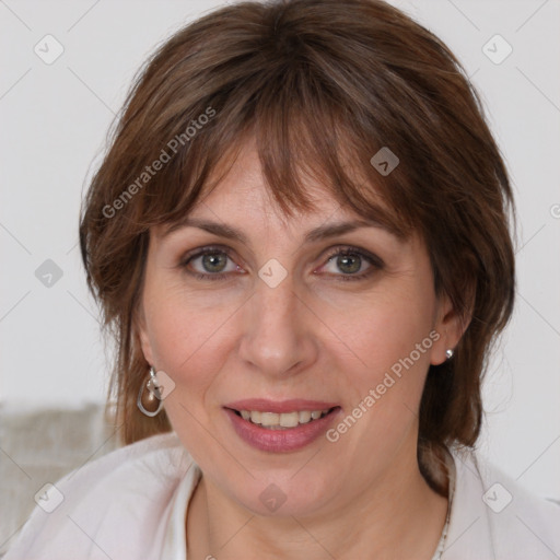 Joyful white adult female with medium  brown hair and brown eyes