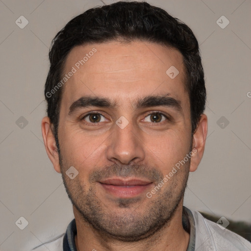 Joyful white young-adult male with short  black hair and brown eyes