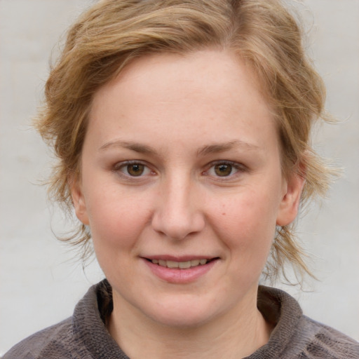 Joyful white young-adult female with medium  brown hair and blue eyes