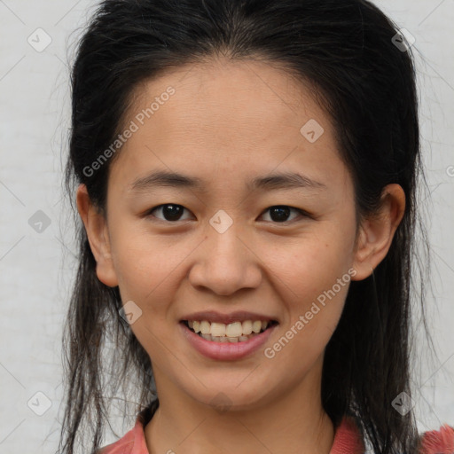 Joyful black young-adult female with medium  brown hair and brown eyes