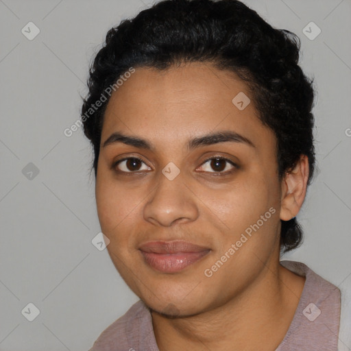 Joyful latino young-adult female with short  black hair and brown eyes