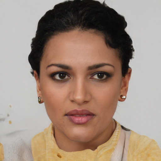 Joyful asian young-adult female with short  black hair and brown eyes