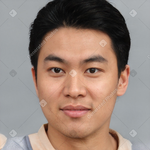 Joyful asian young-adult male with short  black hair and brown eyes