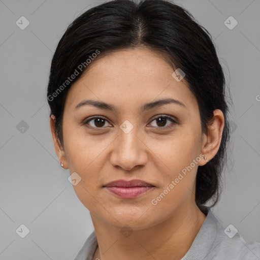 Joyful latino young-adult female with medium  brown hair and brown eyes