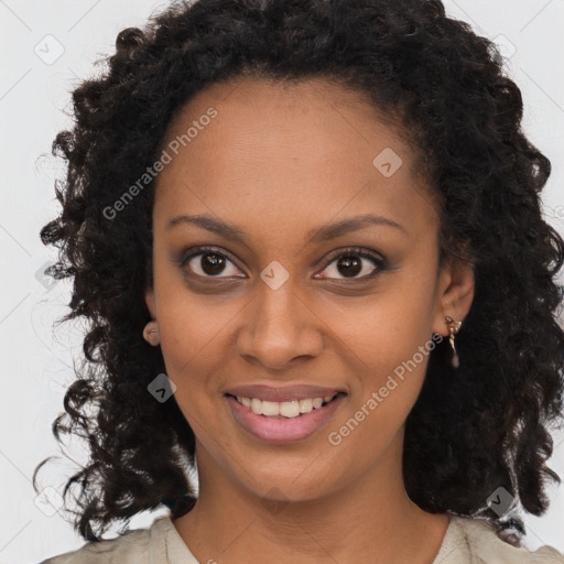 Joyful black young-adult female with long  brown hair and brown eyes