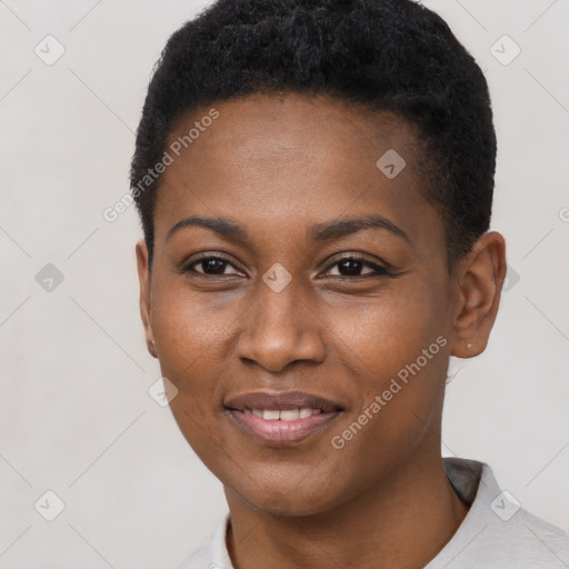 Joyful black young-adult female with short  black hair and brown eyes