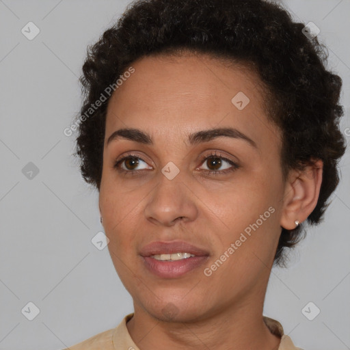 Joyful black young-adult female with short  brown hair and brown eyes