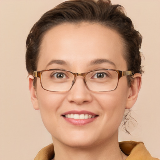 Joyful white adult female with short  brown hair and brown eyes