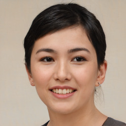 Joyful asian young-adult female with medium  black hair and brown eyes