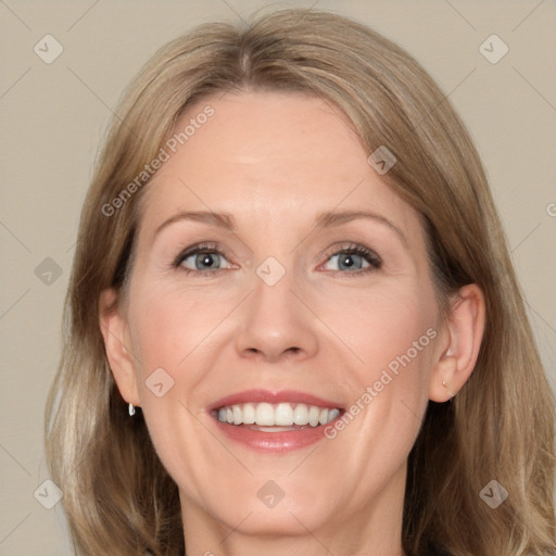 Joyful white adult female with medium  brown hair and grey eyes