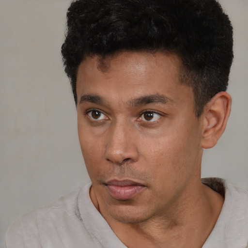 Neutral latino young-adult male with short  brown hair and brown eyes