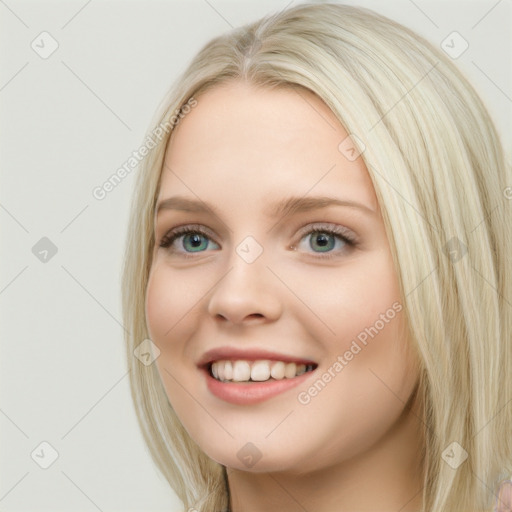 Joyful white young-adult female with long  brown hair and blue eyes