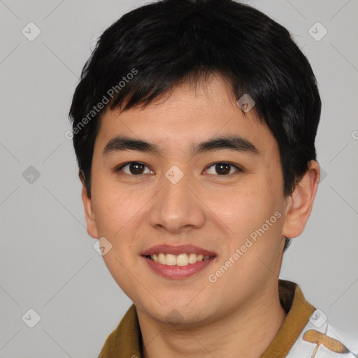 Joyful asian young-adult male with short  brown hair and brown eyes