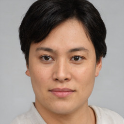 Joyful asian young-adult female with short  brown hair and brown eyes