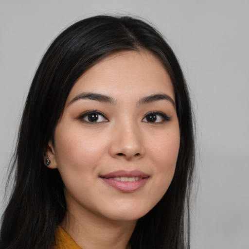 Joyful white young-adult female with long  black hair and brown eyes