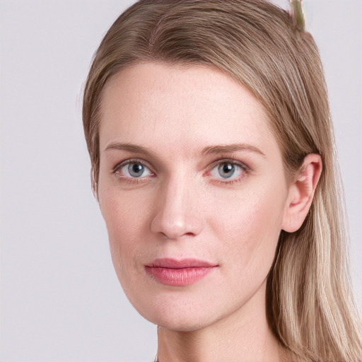 Joyful white young-adult female with long  brown hair and blue eyes