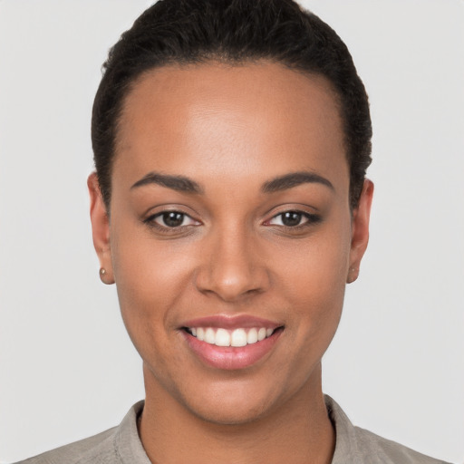 Joyful latino young-adult female with short  brown hair and brown eyes