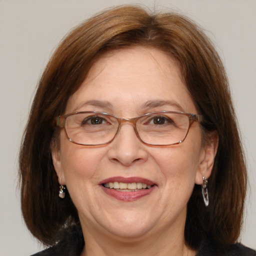 Joyful white middle-aged female with medium  brown hair and brown eyes