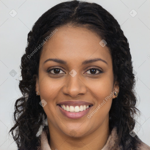 Joyful black young-adult female with long  brown hair and brown eyes