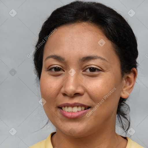 Joyful latino young-adult female with medium  brown hair and brown eyes