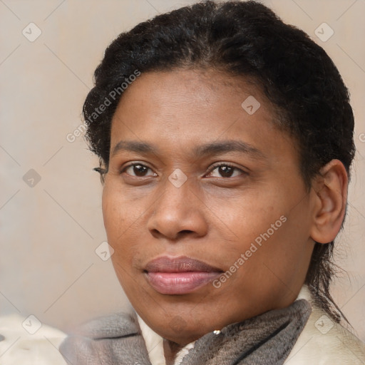 Joyful black adult female with short  brown hair and brown eyes