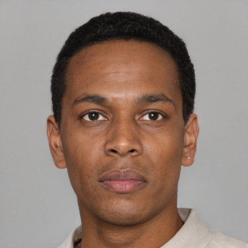 Neutral black young-adult male with short  black hair and brown eyes