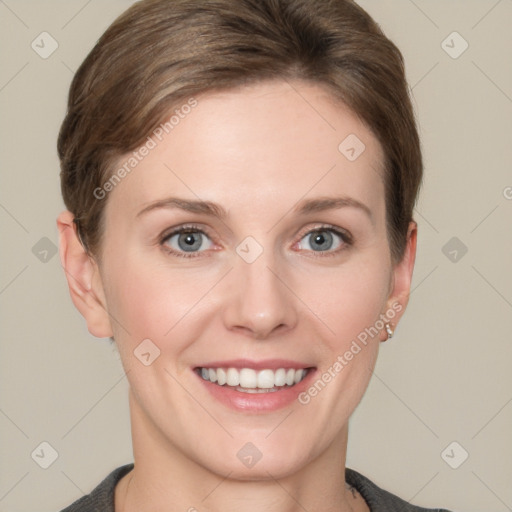 Joyful white young-adult female with short  brown hair and grey eyes