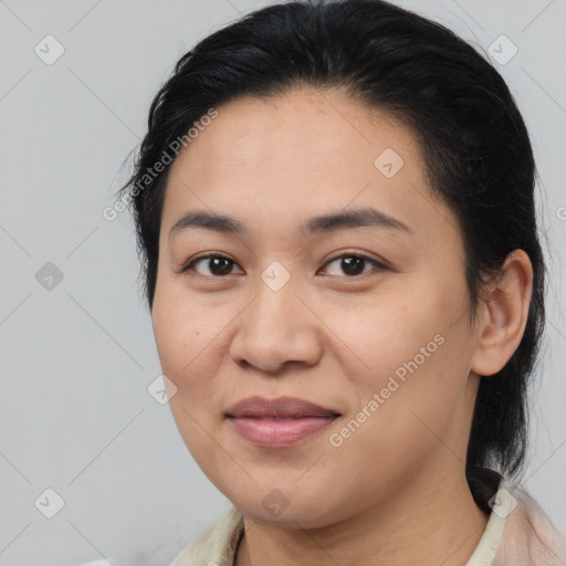 Joyful latino young-adult female with medium  brown hair and brown eyes