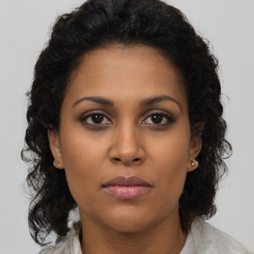 Neutral latino young-adult female with medium  brown hair and brown eyes