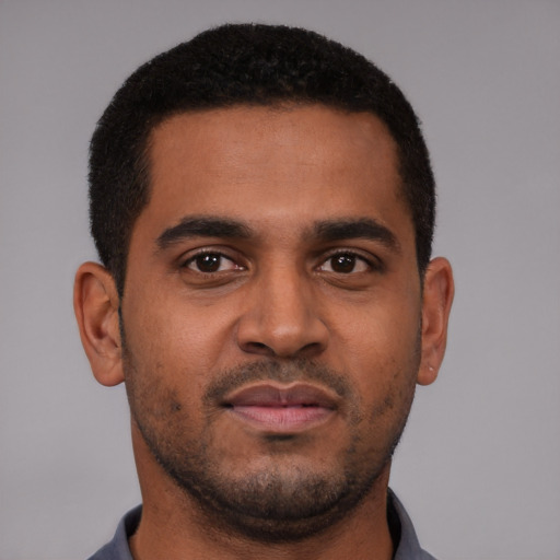 Neutral black young-adult male with short  black hair and brown eyes