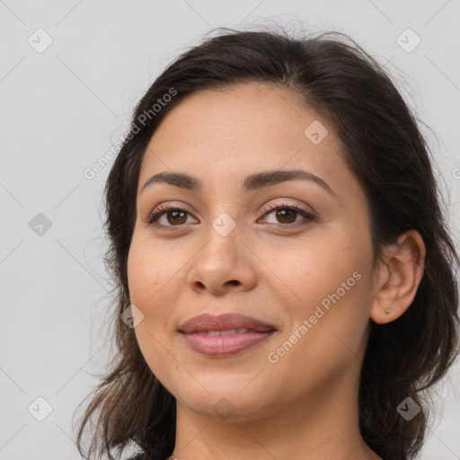 Joyful white young-adult female with long  brown hair and brown eyes