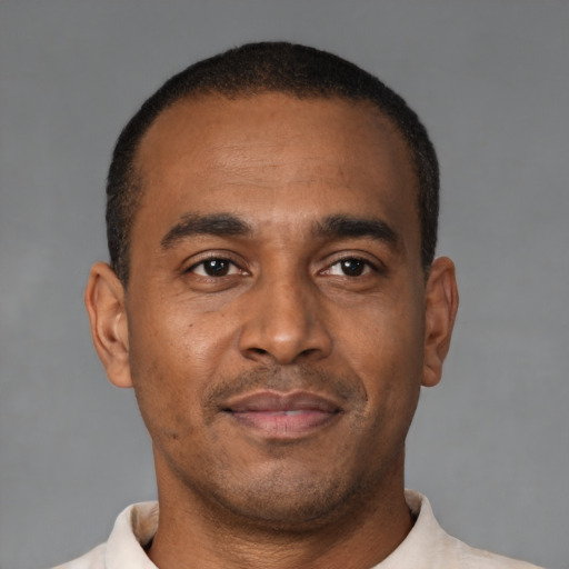 Neutral latino young-adult male with short  brown hair and brown eyes