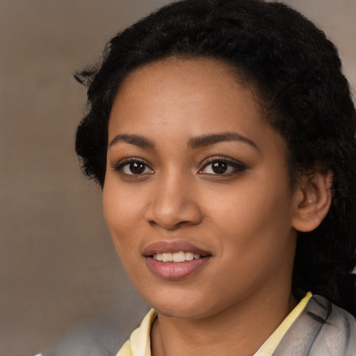 Joyful latino young-adult female with short  black hair and brown eyes