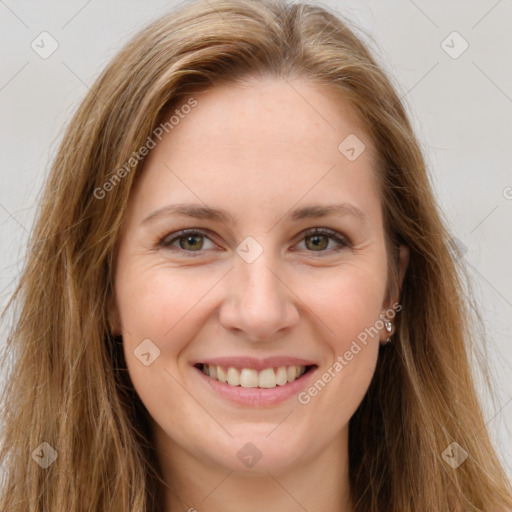 Joyful white young-adult female with long  brown hair and green eyes