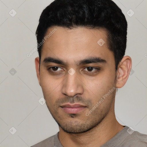 Neutral latino young-adult male with short  black hair and brown eyes